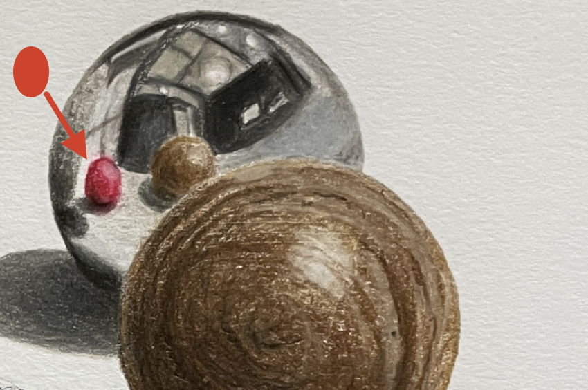 A sphere is reflected on another sphere