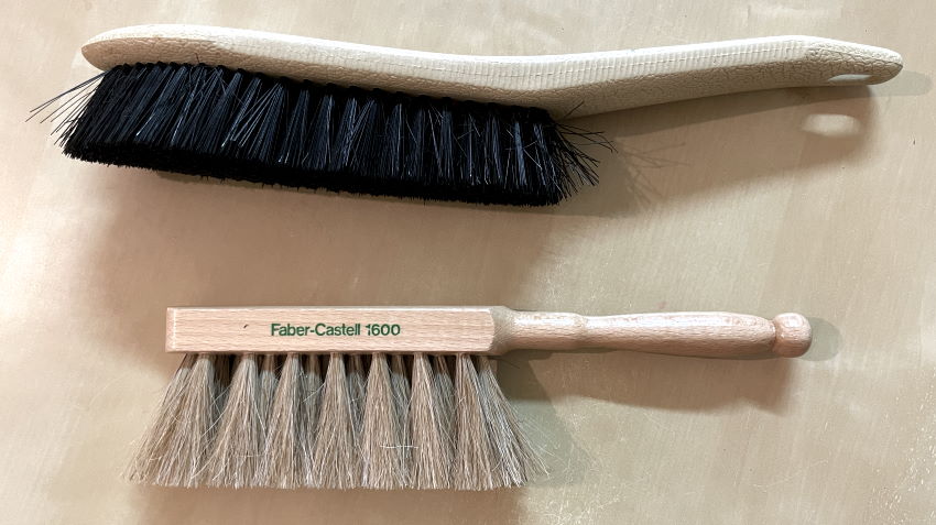 Brushes to clean dust from erasers